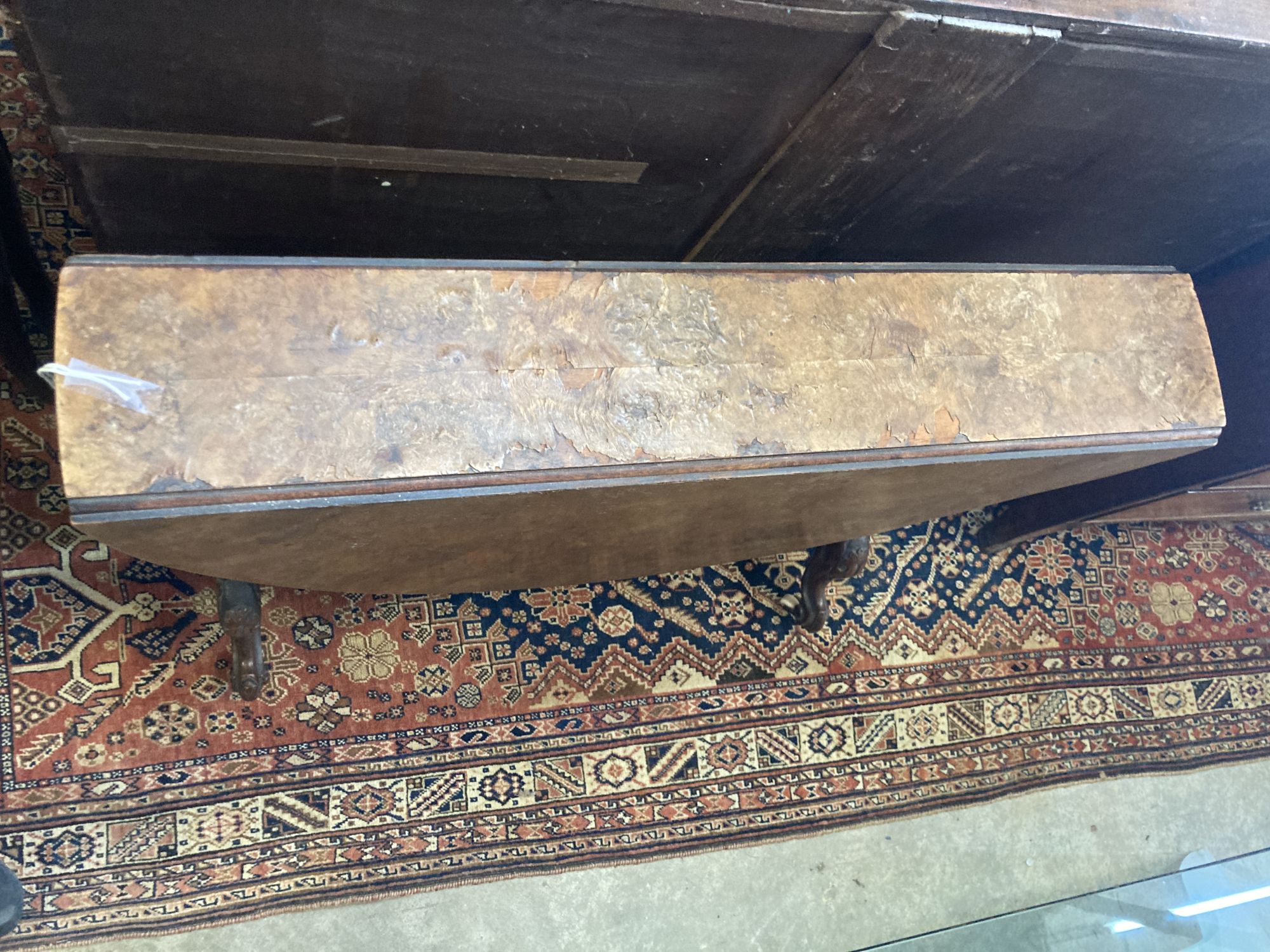 A Victorian walnut Sutherland table, width 89cm depth 17cm height 72cm